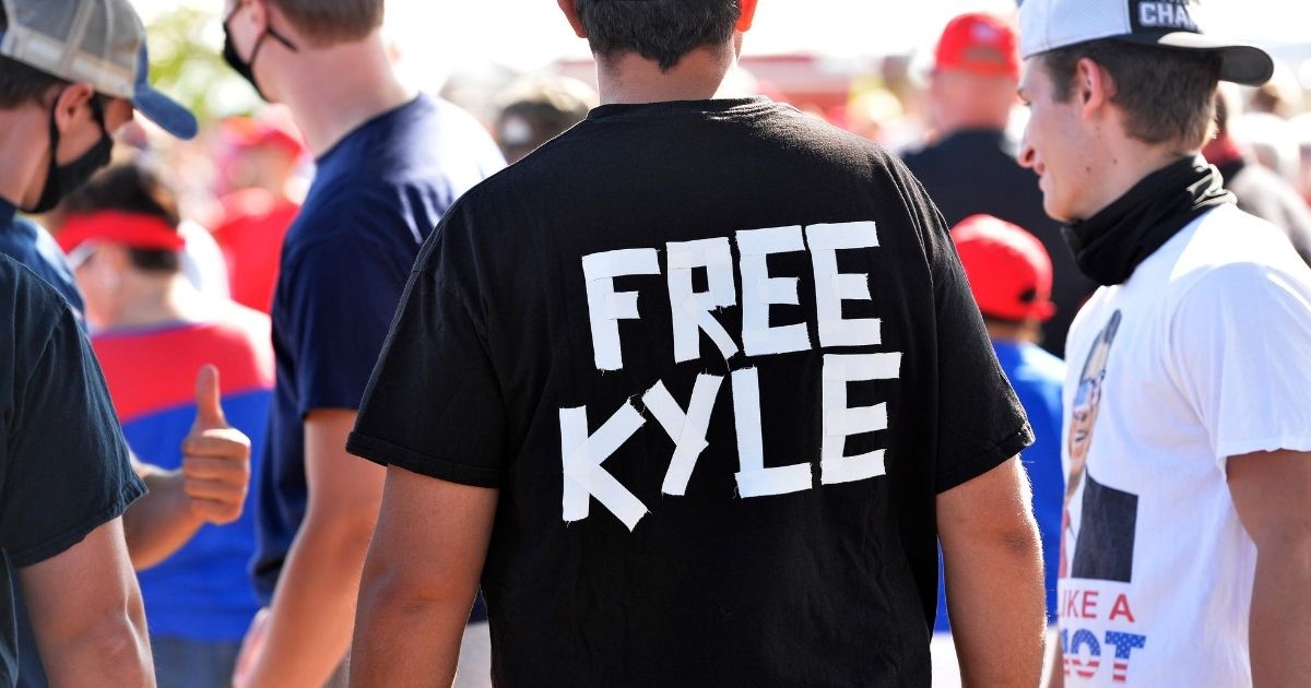A man wears a shirt calling for freedom for Kyle Rittenhouse, the teenager who allegedly shot rioters in Wisconsin, during a Trump campaign rally in Londonderry, New Hampshire, on Aug. 28, 2020.