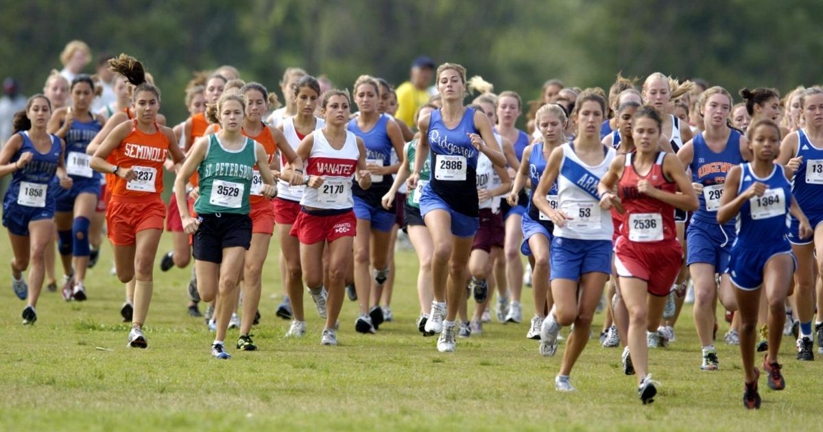 Girls compete in a cross country race in this stock image.