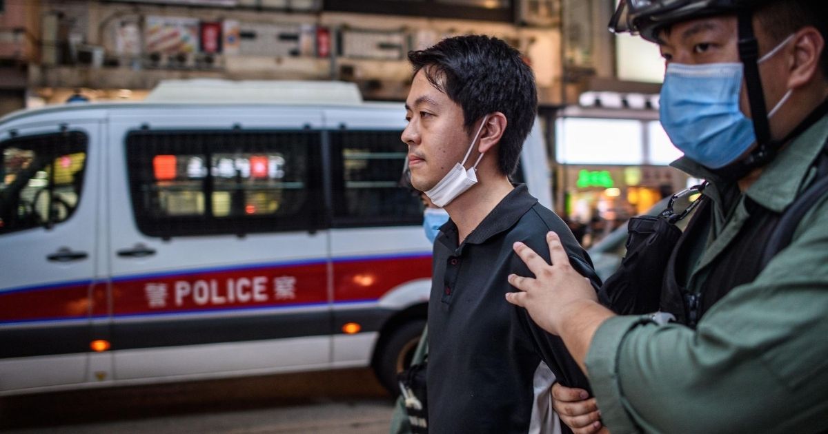 Pro-democracy legislator Ted Hui is detained by police during a pro-democracy rally in Hong Kong on June 12, 2020.
