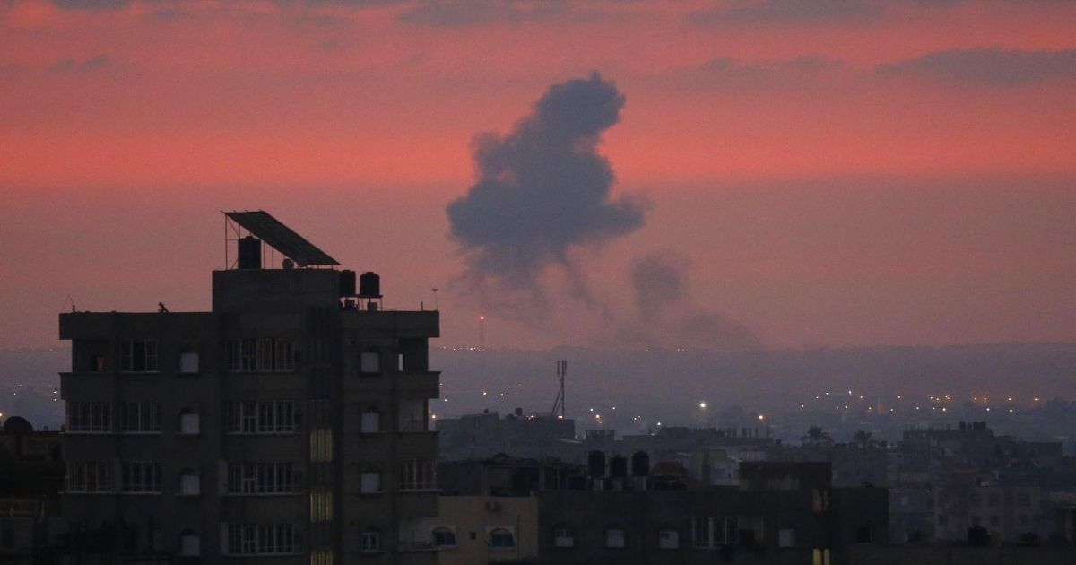 Smoke rises in the distance after Israeli war planes carried out airstrikes over Khan Yunis in the Southern Gaza Strip early on Aug. 21, 2020.