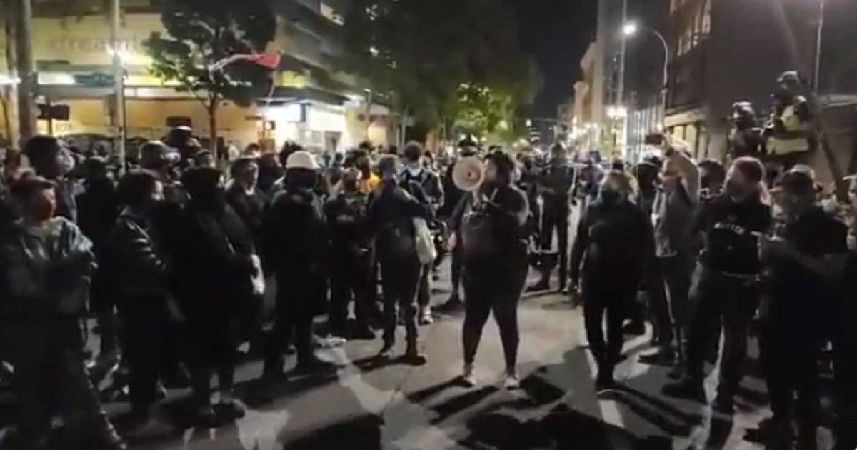 A leftist screams into a bullhorn after the shooting death of a Donald Trump supporter in Portland, Oregon, on Saturday night.