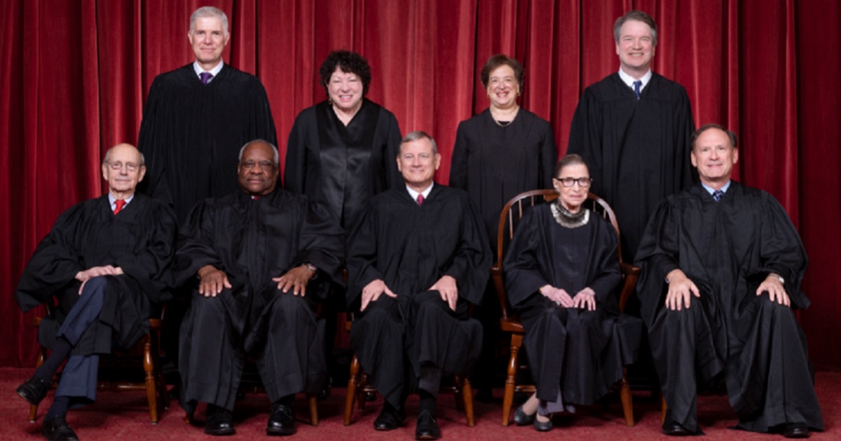 Members of the Supreme Court post for a 2020 picture.