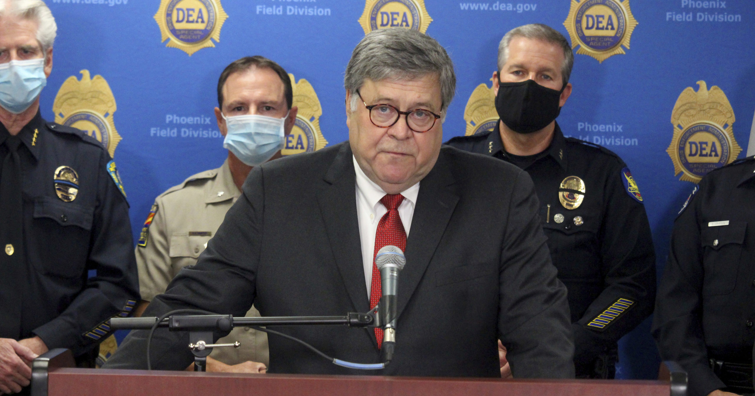 Attorney General William Barr speaks at a news conference on Sept. 10, 2020, in Phoenix.