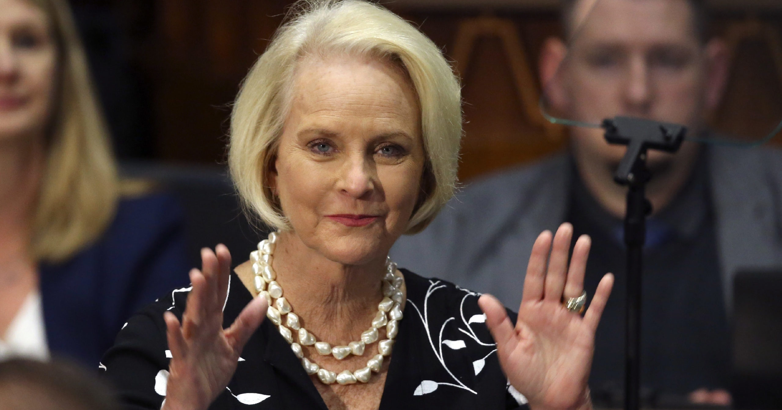In this Jan. 13, 2020, file photo, Cindy McCain, wife of former Arizona Sen. John McCain, waves to the crowd after being acknowledged by Arizona Republican Gov. Doug Ducey during his State of the State address on the opening day of the legislative session at the Capitol in Phoenix.