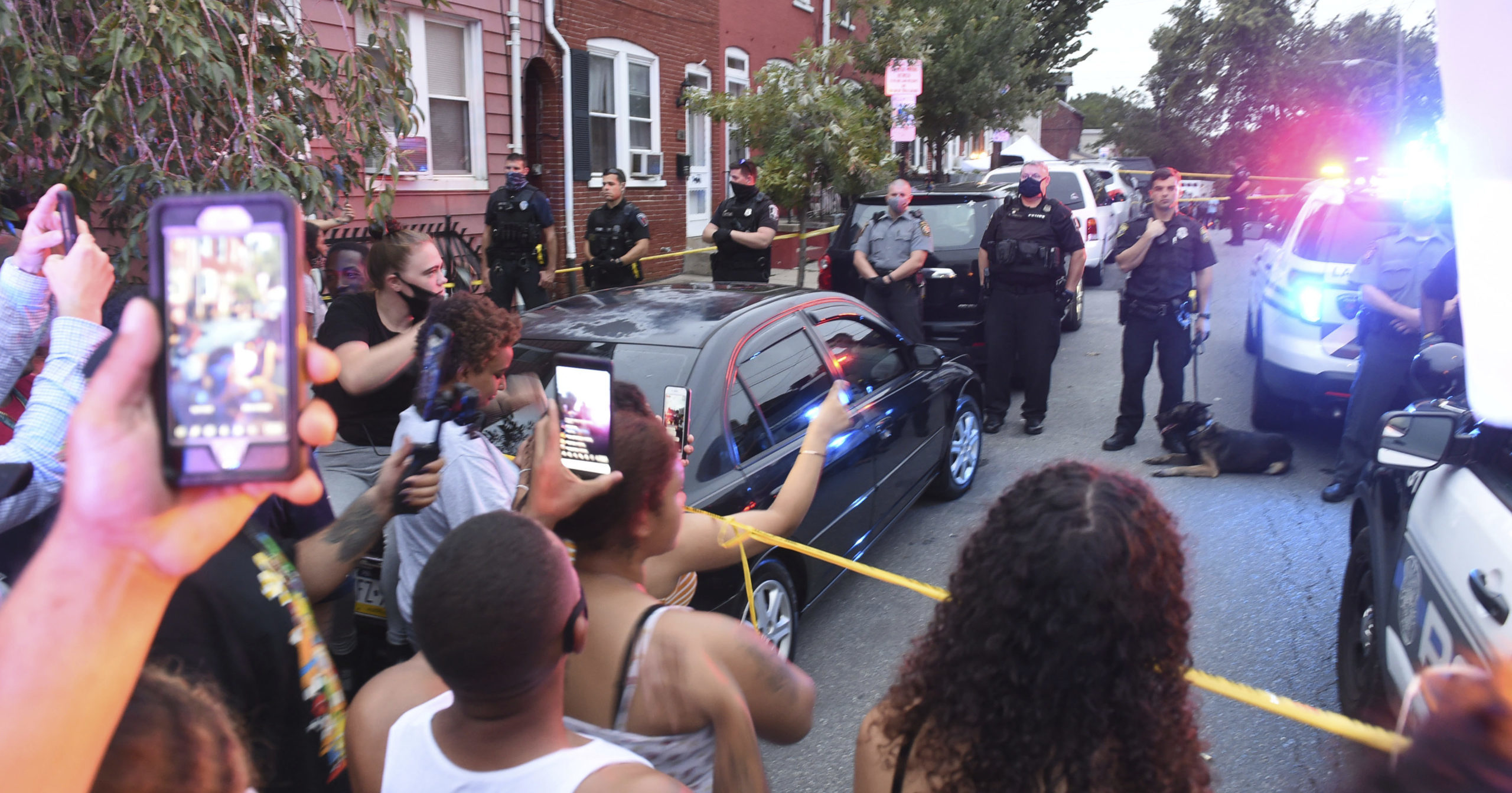 People chant during a protest at the scene of a police shooting in Lancaster, Pennsylvania, on Sept. 13, 2020.