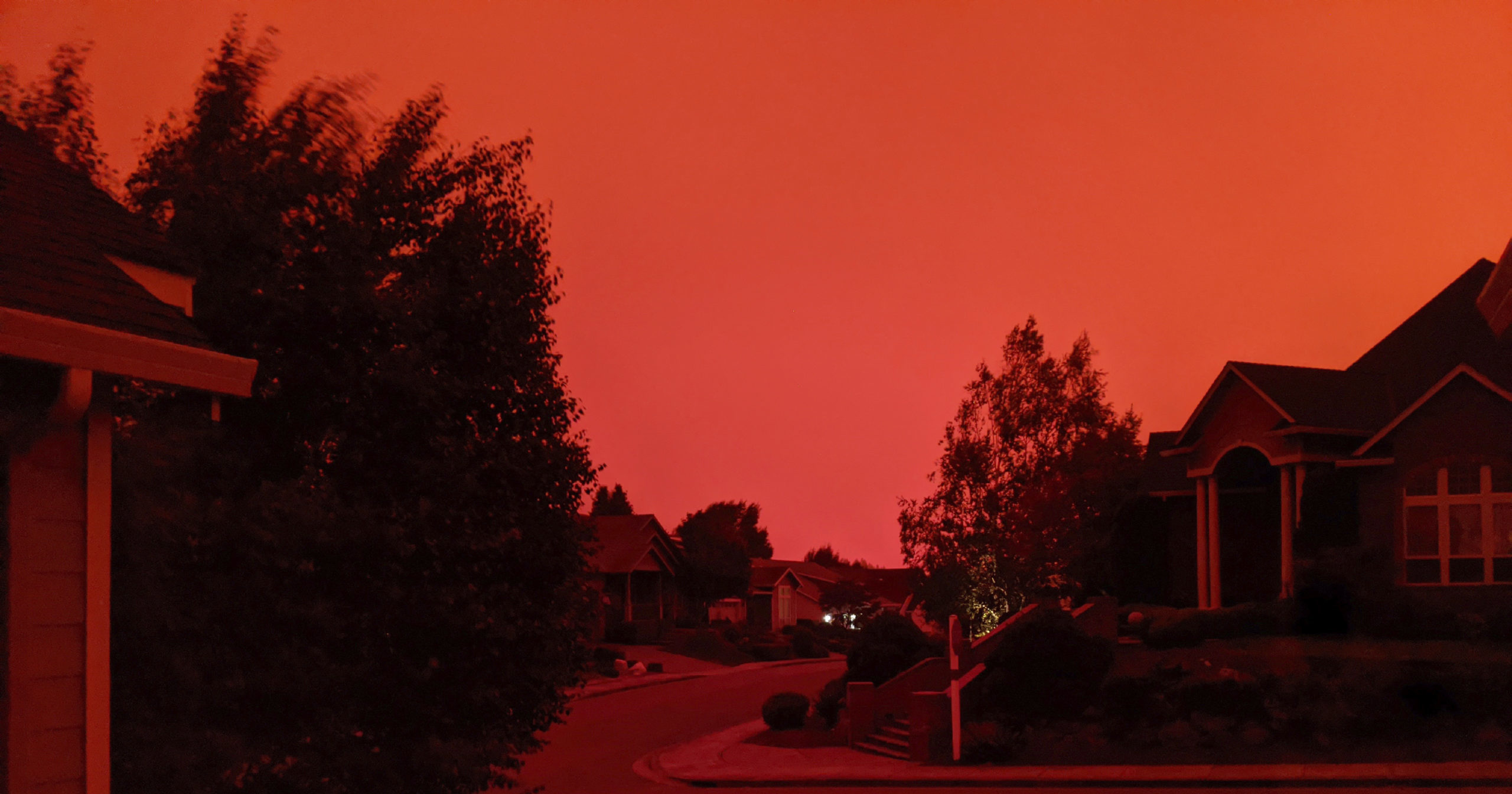 WildfiresThe sky appears red due to fires raging across the Pacific Northwest. are raging across the Pacific Northwest.
