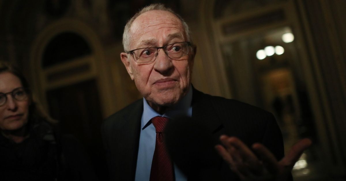 Attorney Alan Dershowitz, a member of President Donald Trump's legal team, talks to reporters in the Senate Reception Room at the U.S. Capitol on Jan. 29, 2020.