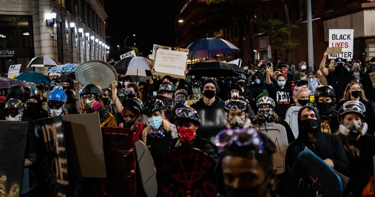 Protesters march for the sixth consecutive night of protest on Sept. 7, 2020, in Rochester, New York.