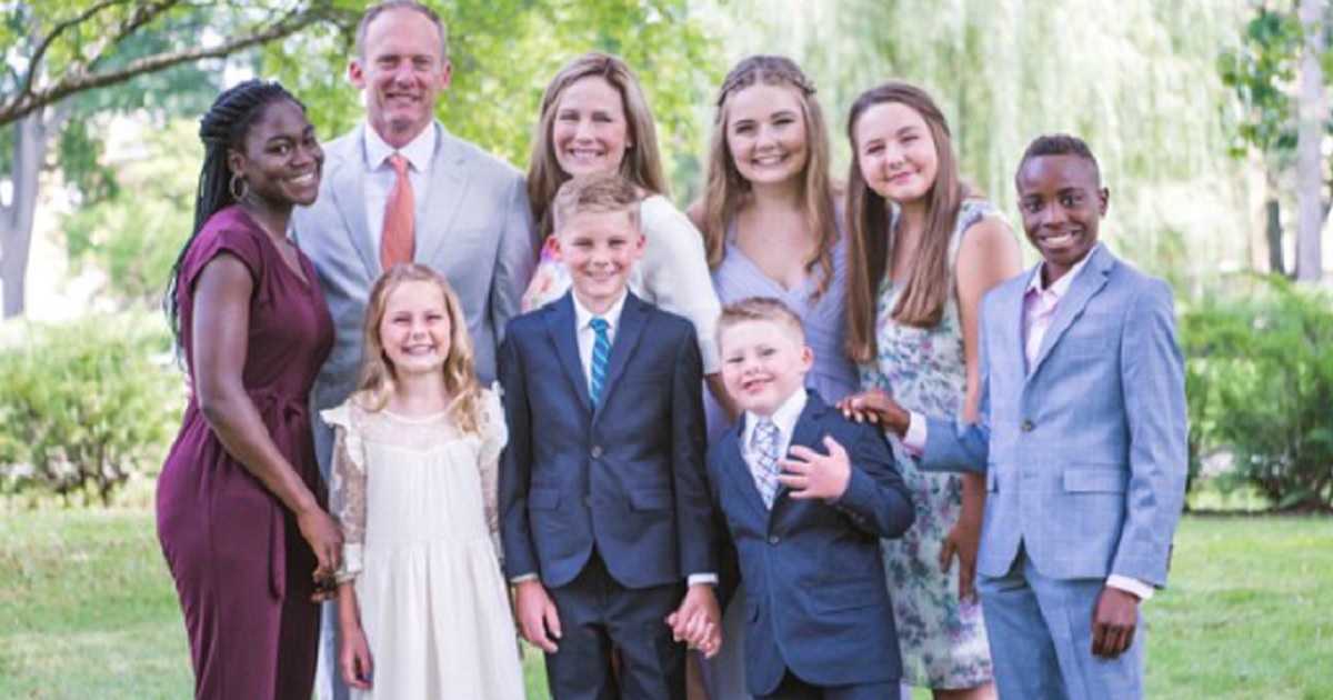 Supreme Court nominee Amy Coney-Barret in a family portrait with her husband and seven children -- two of them adoptees from Haiti.