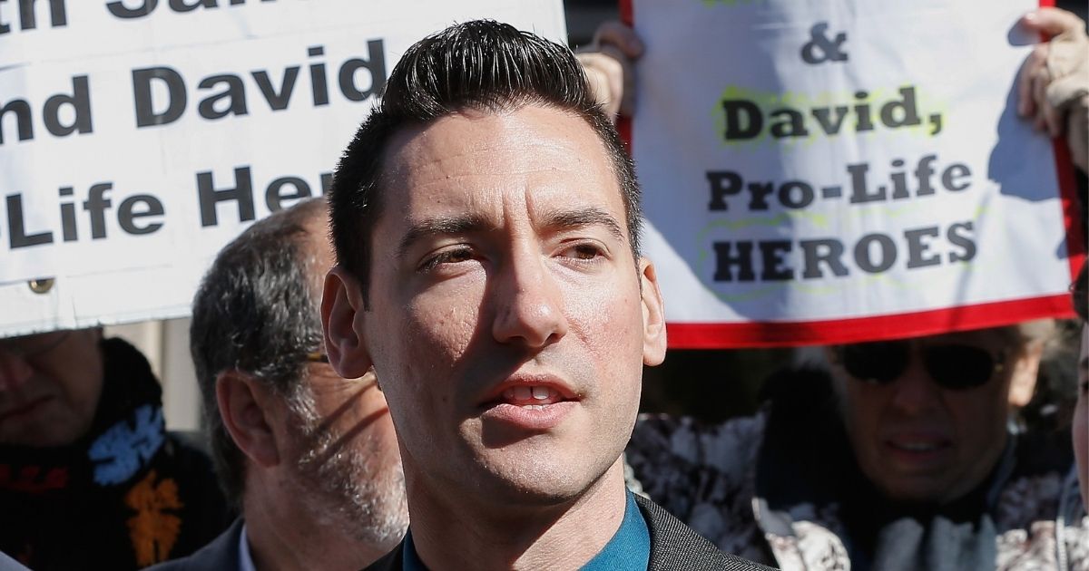 David Daleiden speaks to supporters outside the Harris County Criminal Courthouse after turning himself in to authorities on Feb. 4, 2016, in Houston.