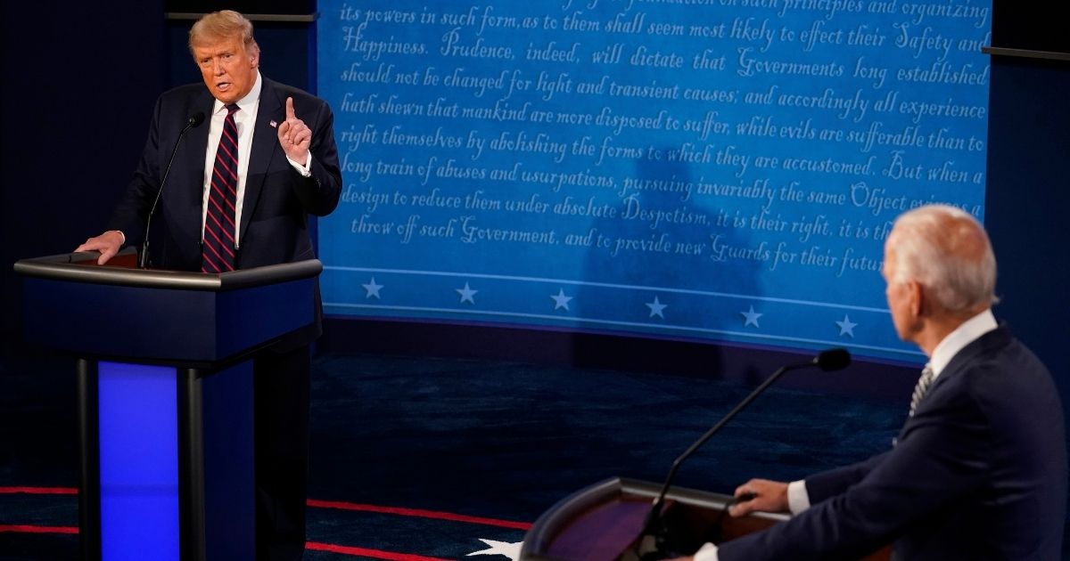 President Donald Trump makes a point as Democratic presidential candidate former Vice President Joe Biden looks on during the first presidential debate Tuesday at Case Western University and Cleveland Clinic in Cleveland, Ohio.