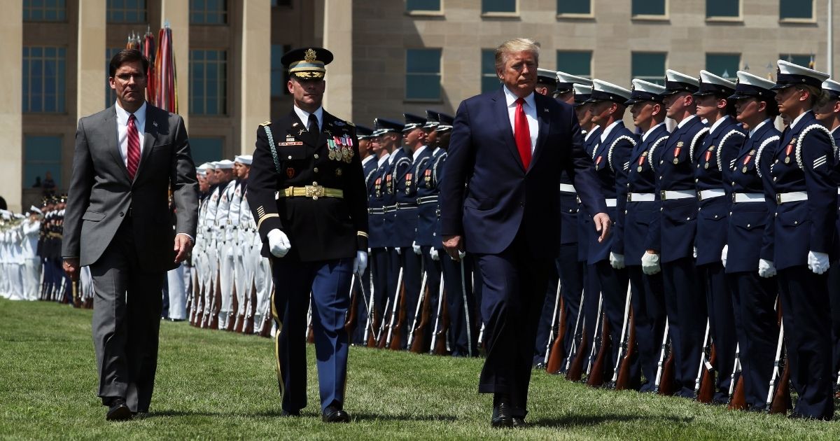 President Donald Trump, right, and Secretary of Defense Dr. Mark Esper, left, inspect the troops during a full honors welcome ceremony on the parade grounds at the Pentagon, on July 25, 2019, in Arlington, Virginia.