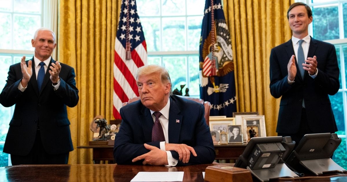 President Donald Trump, flanked by Vice President Mike Pence, left, and senior adviser Jared Kushner, speaks in the Oval Office on Sept. 11, 2020, to announce that Bahrain will establish diplomatic relations with Israel.