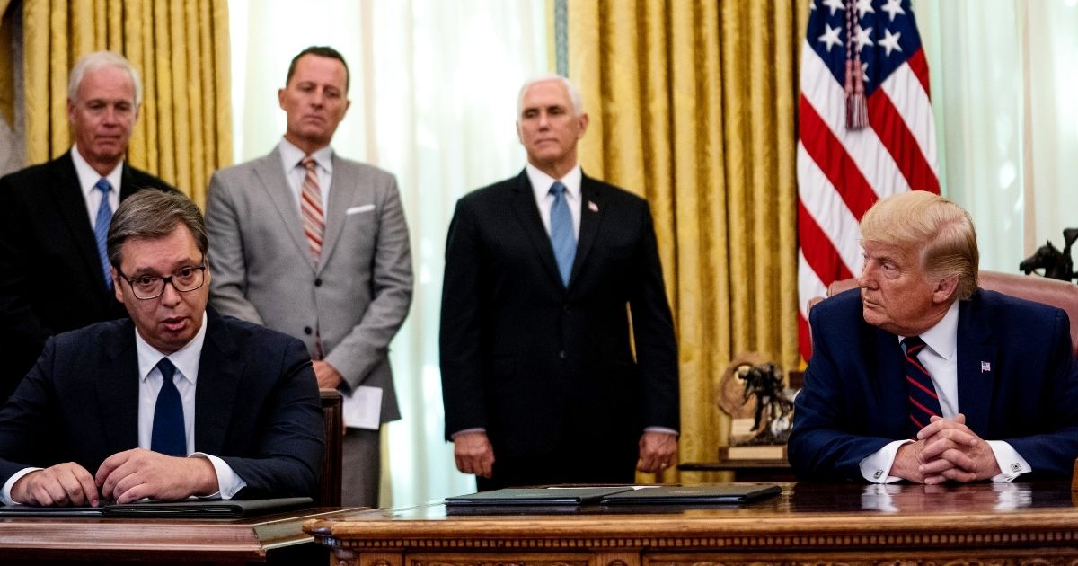 Serbian President Aleksandar Vucic speaks as U.S. President Donald Trump listens during in a signing ceremony and meeting in the Oval Office of the White House on Sept. 4, 2020, in Washington, D.C.