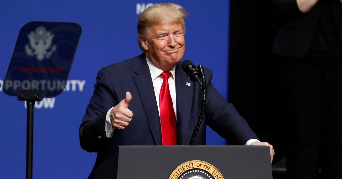 President Donald Trump gives a thumbs up as he speaks during the North Carolina Opportunity Now Summit in Charlotte, North Carolina, on Feb. 7, 2020.