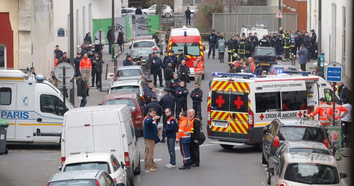 Ambulances are seen in the street outside the Paris office of the French satirical newspaper Charlie Hebdo on Jan. 7, 2015.