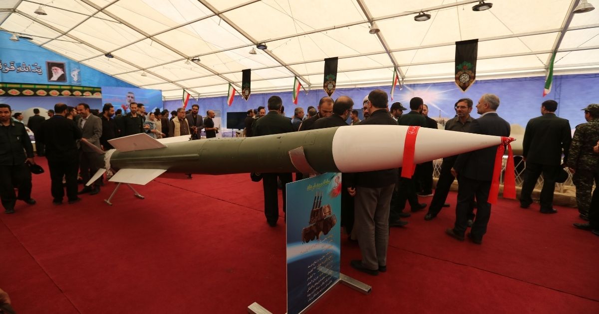 Visitors gather around a missile of the 3-Khordad missile system, at Tehran's Islamic Revolution and Holy Defense museum, during the unveiling of an exhibition of what Iran says are U.S. and other drones captured in its territory, in the Iranian capital Tehran on Sept. 21, 2019.