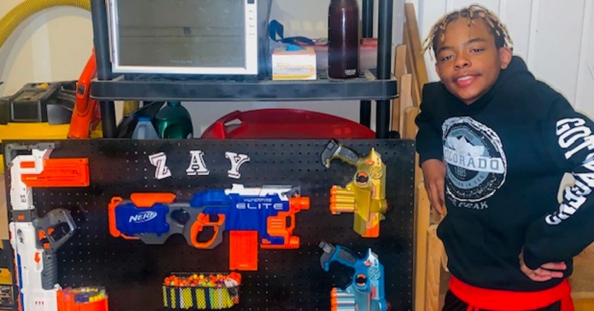Isaiah Elliott, a seventh-grader in Colorado Springs, shows off his toy gun collection.