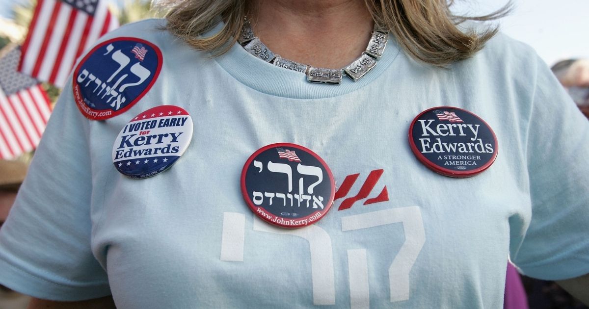 A woman wears a campaign shirt and buttons written in Hebrew supporting democratic presidential candidate John Kerry during a rally at Florida Atlantic University on Oct. 24, 2004, in Boca Raton, Florida.