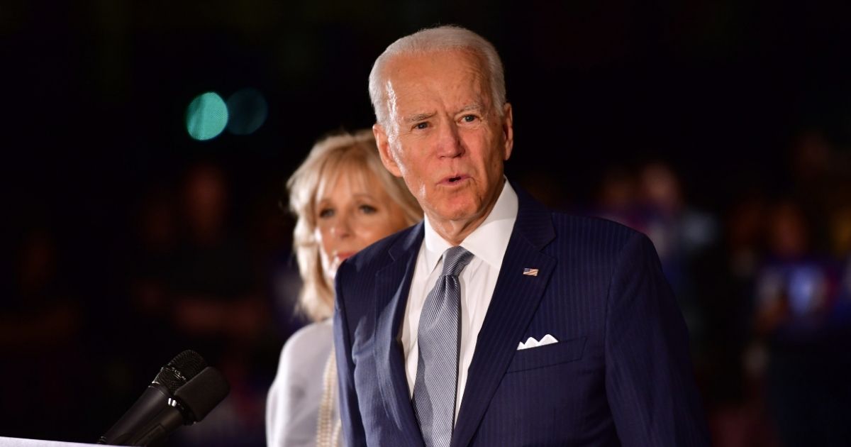 Former Vice President Joe Biden addresses the media and a small group of supporters with his wife, Jill Biden, during a primary night event on March 10, 2020, in Philadelphia.