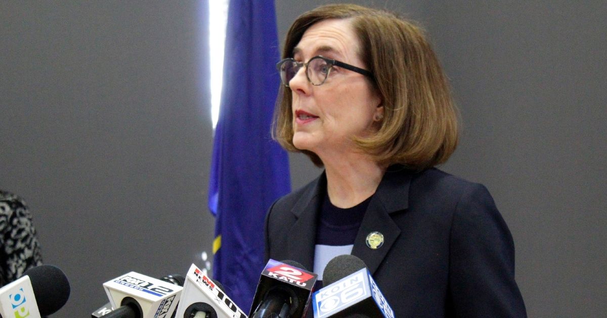 In this March 16, 2020, file photo, Oregon Gov. Kate Brown speaks at a news conference in Portland, Oregon.