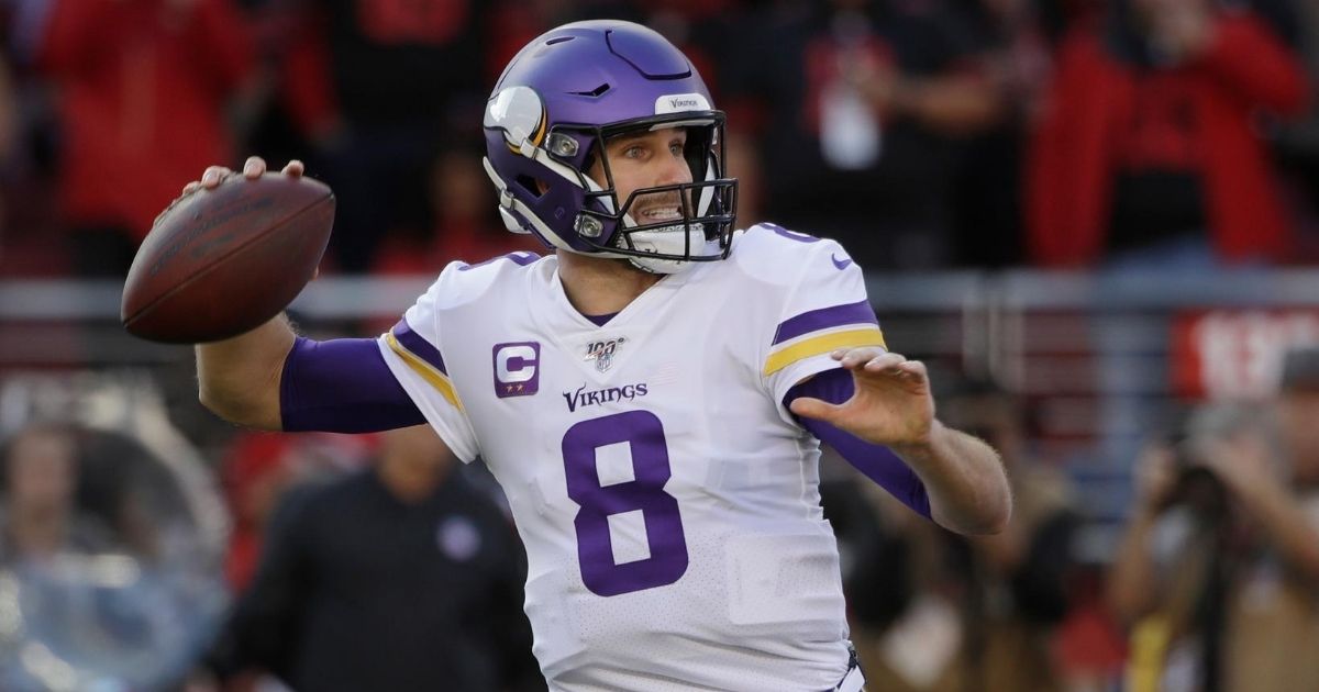 In this Jan. 11, 2020, file photo, Minnesota Vikings quarterback Kirk Cousins (8) passes against the San Francisco 49ers during the first half of an NFL divisional playoff football game in Santa Clara, California.