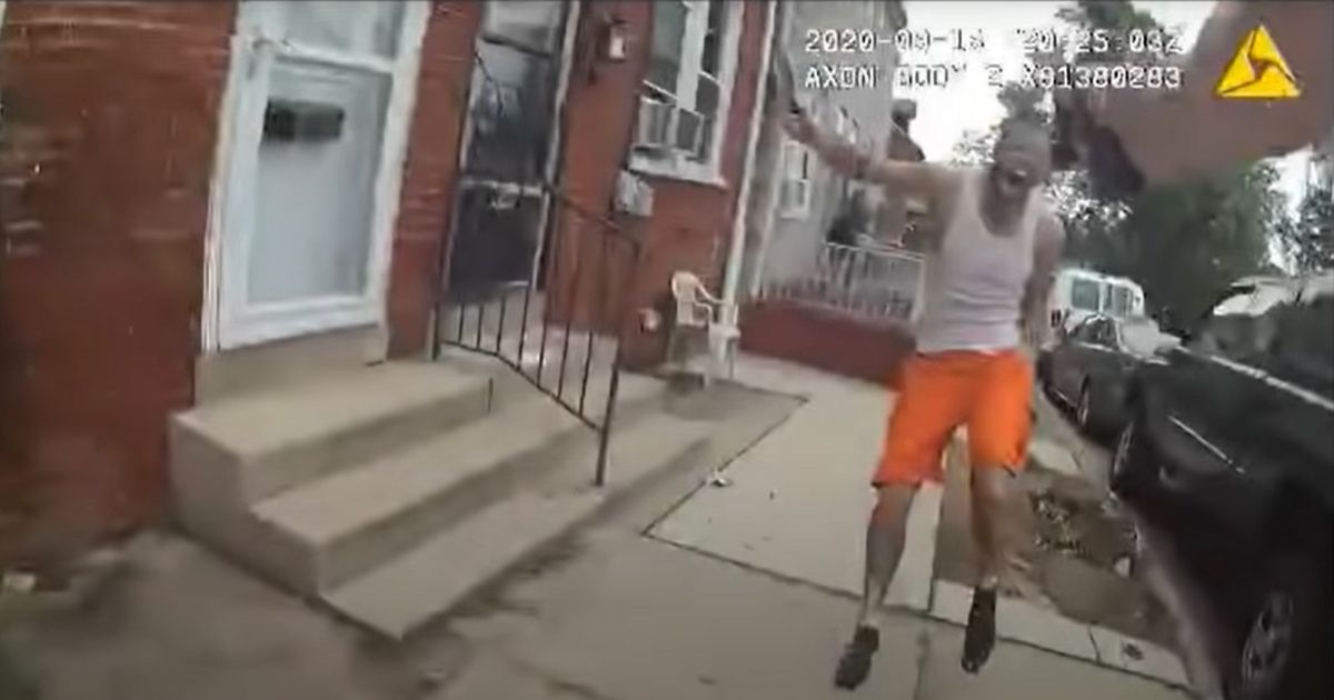 A man armed with a knife runs toward a police officer in Lancaster, Pennsylvania.