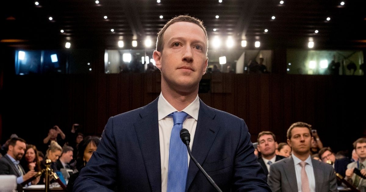 Facebook CEO Mark Zuckerberg arrives to testify before a joint hearing of the Commerce and Judiciary Committees on Capitol Hill in Washington, D.C., on April 10, 2018.