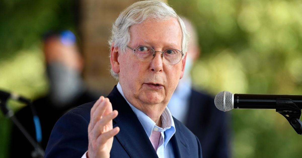 Senate Majority Leader Mitch McConnell speaks with reporters during a visit to the Beaver Dam Ampitheater in Beaver Dam, Kentucky on Aug. 25, 2020.