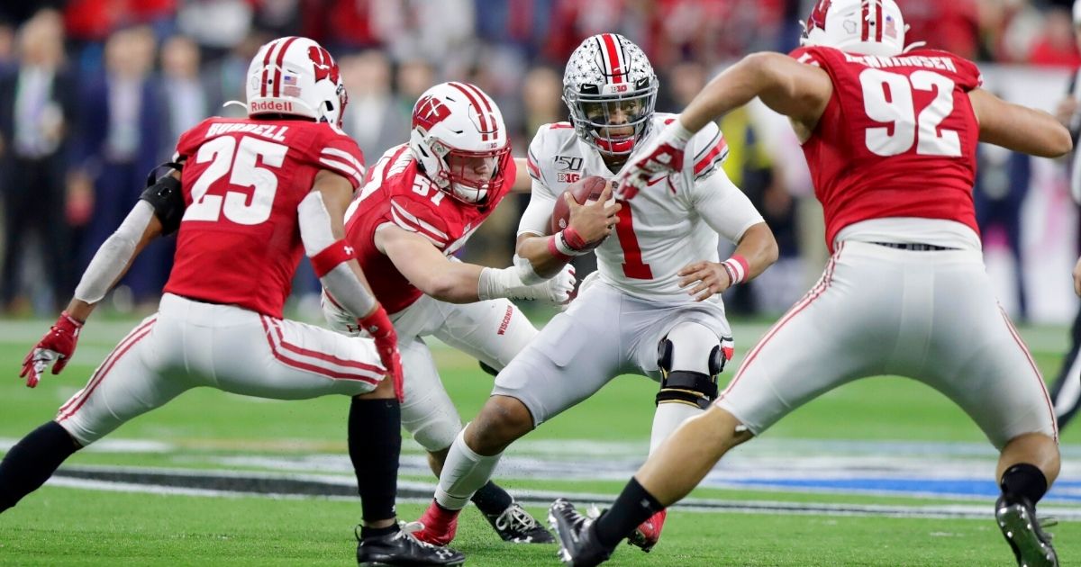 Ohio State quarterback Justin Fields is surrounded by Wisconsin defenders during the Big Ten championship game Dec. 7, 2019, in Indianapolis.