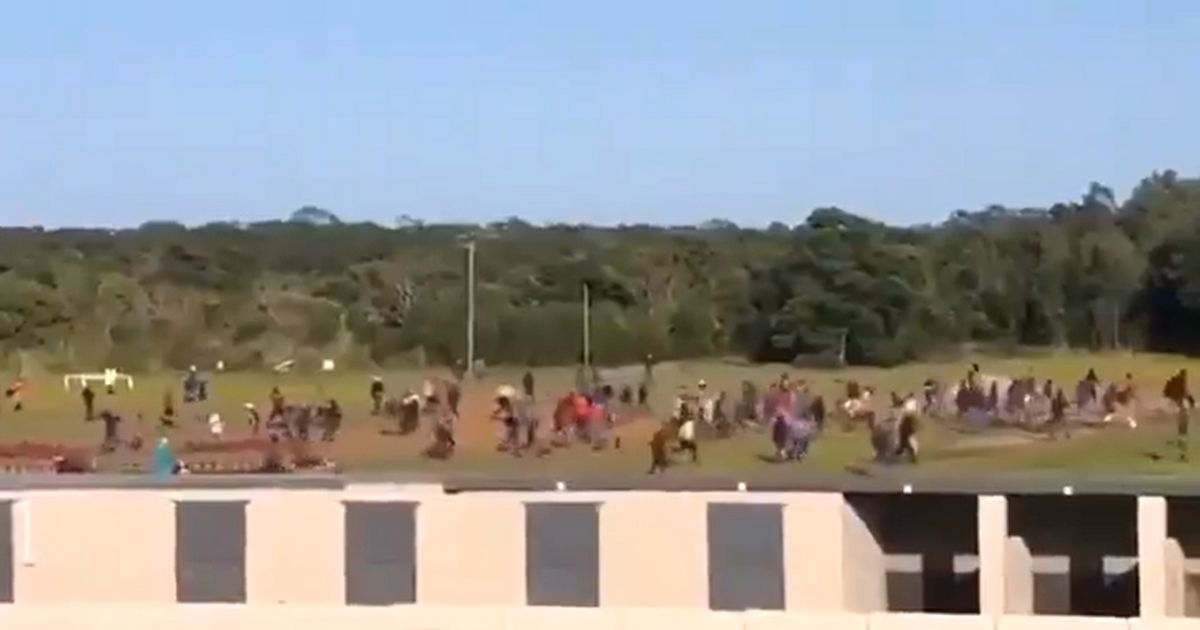 Demonstrators storm the Fairview Race Course in Port Elizabeth, South Africa.