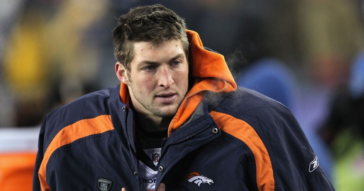 Tim Tebow #15 of the Denver Broncos looks on against the New England Patriots on Jan. 14, 2012, in Foxboro, Massachusetts.