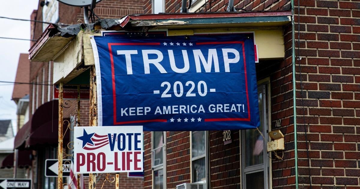 Political posters favoring President Donald Trump are attached to an overhang on Sept. 11, 2020, in Scranton, Pennsylvania.