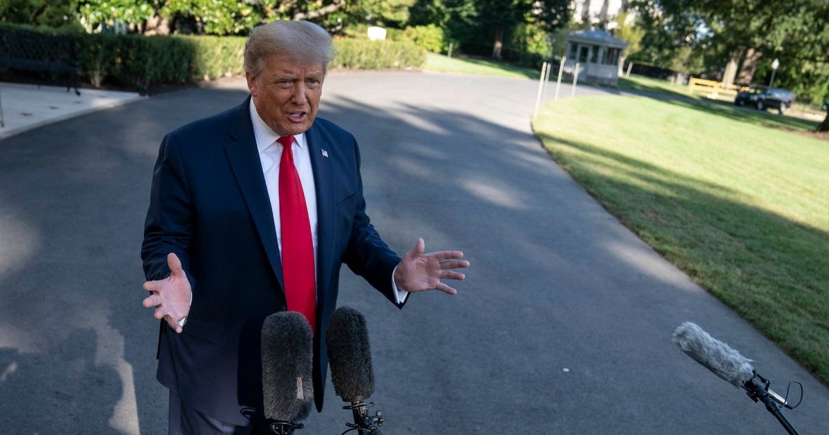 Trump speaks with reporters