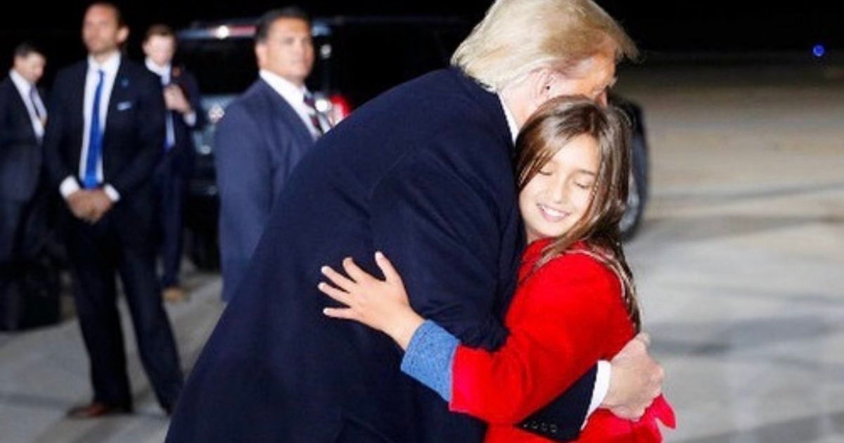 President Donald Trump hugs 9-year-old granddaughter Arabella.