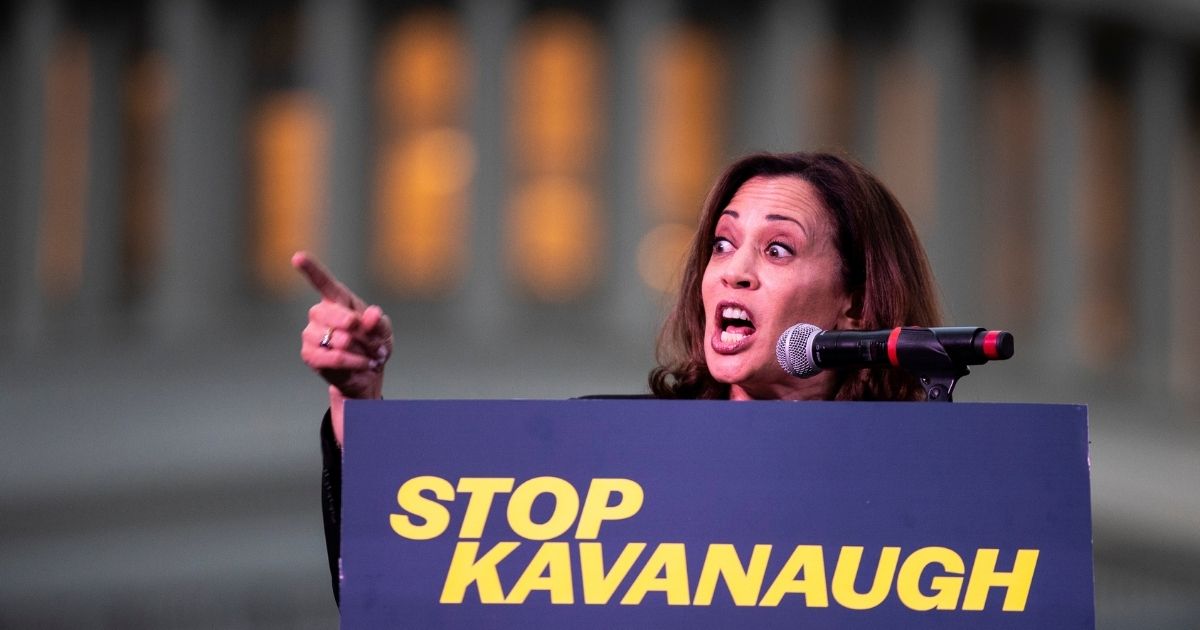 WASHINGTON, DC - OCTOBER 4: U.S. Sen. Kamala Harris (D-CA) speaks to protestors rallying against Supreme Court nominee Judge Brett Kavanaugh on Capitol Hill, October 4, 2018 in Washington, DC. Kavanaugh's confirmation process was halted for less than a week so that FBI investigators could look into allegations by Dr. Christine Blasey Ford, a California professor who who has accused Kavanaugh of sexually assaulting her during a party in 1982 when they were high school students in suburban Maryland.