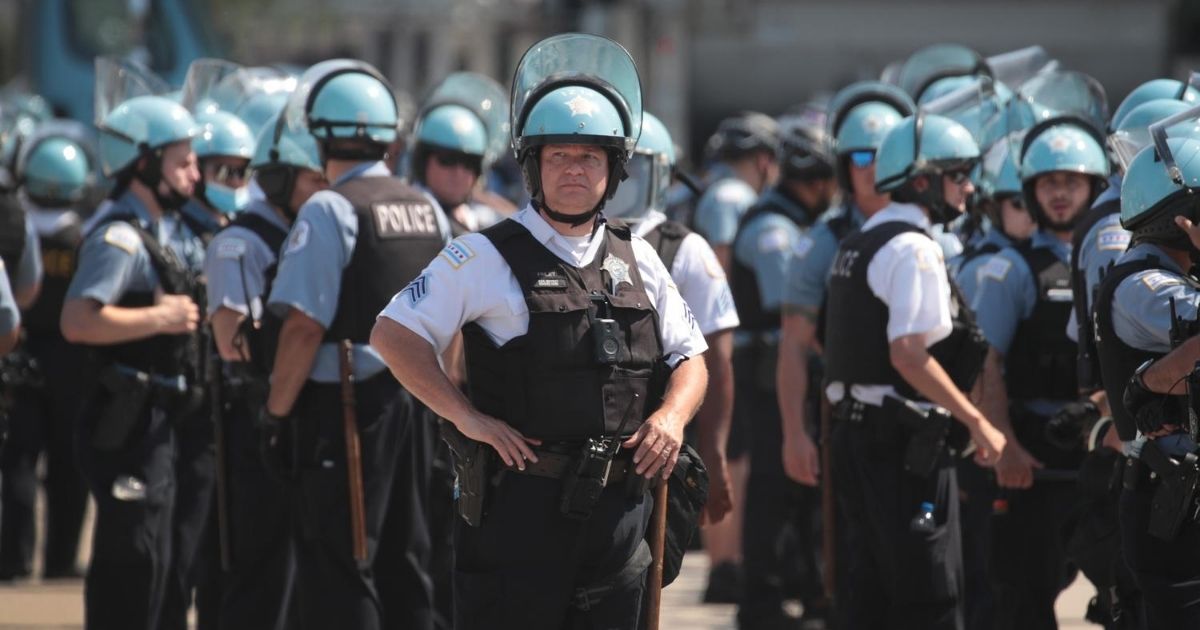 Police officers stand guard at a Blue Lives Matter protest on July 25, 2020, in Chicago.