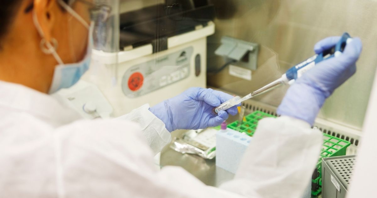 A medical technologist processes test samples for COVID-19 at the AdventHealth Tampa labs on June 25, 2020, in Tampa, Florida.