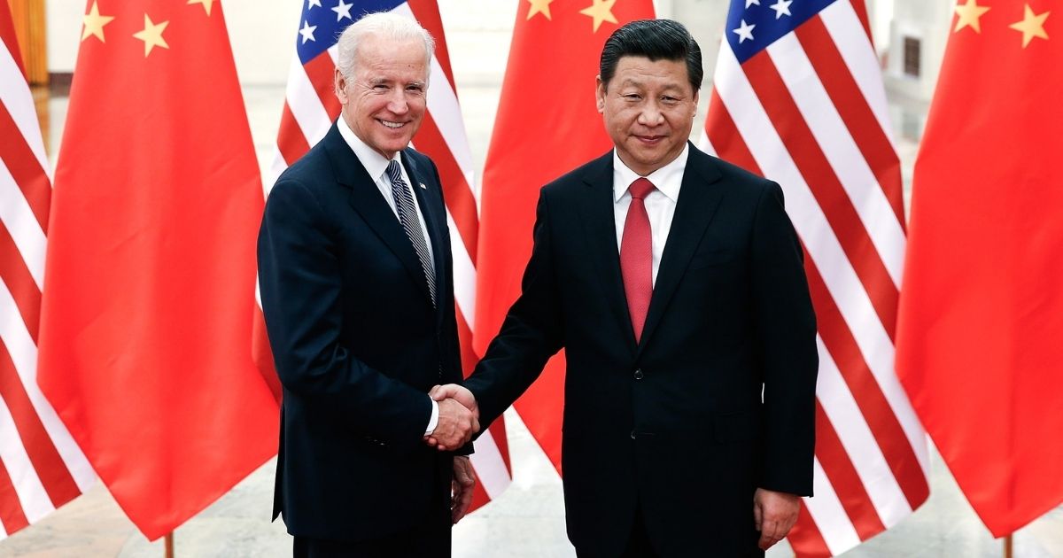 Chinese President Xi Jinping, right, shake hands with U.S Vice President Joe Biden inside the Great Hall of the People on Dec. 4, 2013, in Beijing.