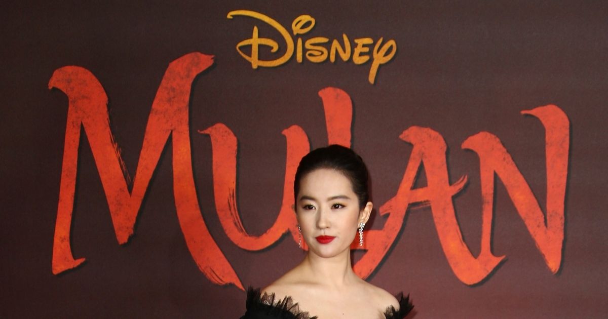 Actress Liu Yifei poses for photographers upon her arrival at the European Premiere of "Mulan" in London on Mar. 12, 2020.