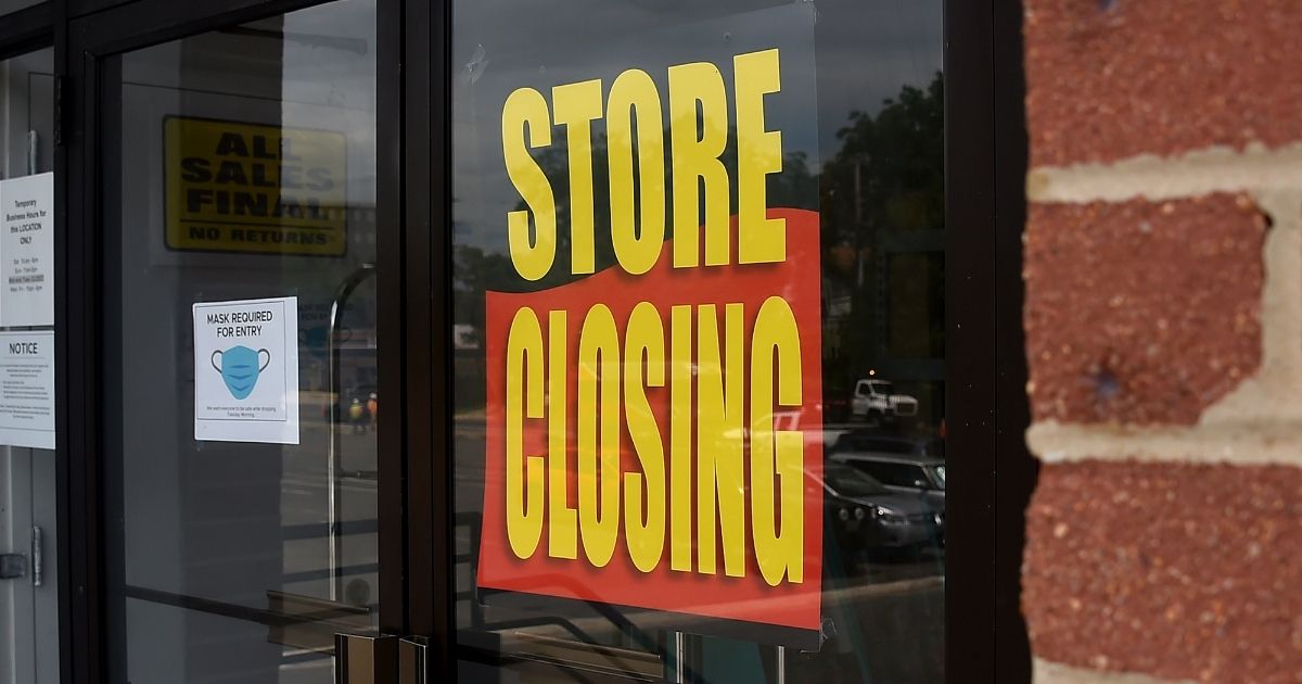 A store displays a sign before closing down permanently as more businesses feel the effects of stay-at-home orders amid the coronavirus pandemic on June 16, 2020, in Arlington, Virginia.