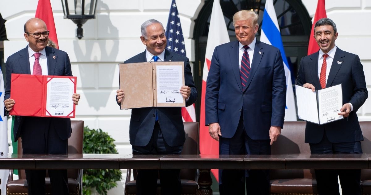 From left to right, Bahrain Foreign Minister Abdullatif al-Zayani, Israeli Prime Minister Benjamin Netanyahu, U.S. President Donald Trump and UAE Foreign Minister Abdullah bin Zayed Al-Nahyan hold up documents after participating in the signing of the Abraham Accords, in which the countries of Bahrain and the United Arab Emirates formally recognize Israel, at the White House on Sept. 15, 2020.