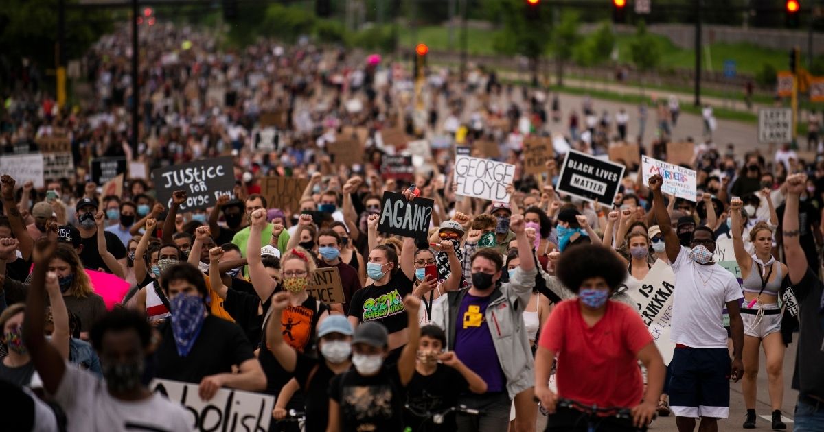 MINNEAPOLIS, MN - MAY 26: Protesters march on Hiawatha Avenue while decrying the killing of George Floyd on May 26, 2020 in Minneapolis, Minnesota. Four Minneapolis police officers have been fired after a video taken by a bystander was posted on social media showing Floyd's neck being pinned to the ground by an officer as he repeatedly said, "I can’t breathe". Floyd was later pronounced dead while in police custody after being transported to Hennepin County Medical Center.