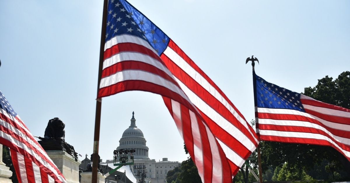 US flags are seen near the Mall in front of the US Capitol in Washington, DC on July 3, 2018, a day ahead of the Independence Day holiday.
