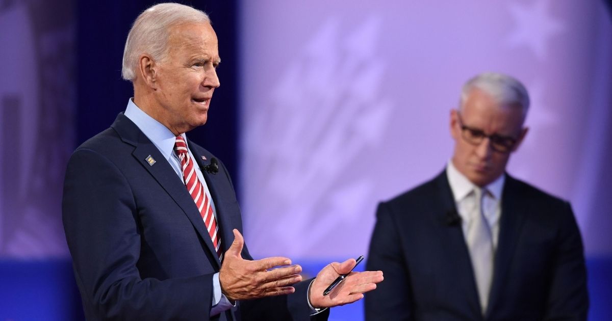 Democratic presidential hopeful former US Vice President Joe Biden speaks, flanked by moderator CNN's Anderson Cooper, during a town hall devoted to LGBTQ issues hosted by CNN and the Human rights Campaign Foundation at The Novo in Los Angeles on October 10, 2019.