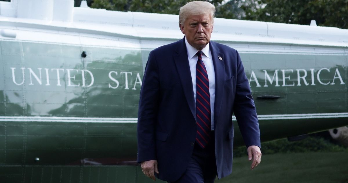 WASHINGTON, DC - JULY 27: U.S. President Donald Trump walks on the South Lawn after he landing aboard Marine One at the White House July 27, 2020 in Washington, DC. Trump was returning from a visit to the FUJIFILM Diosynth Biotechnologies' Innovation Center in Morrisville, North Carolina, a facility that supports manufacturing of "key components of the COVID-19 vaccine candidate" developed by Novavax.