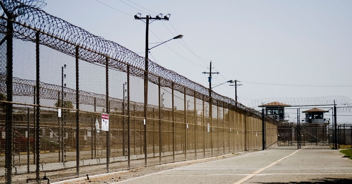 CHINO, CA - AUGUST 19: The California Institution for Men prison fence is seen on August 19, 2009 in Chino, California. After touring the prison where a riot took place on August 8th, California Governor Arnold Schwarzenegger said that the prison system is collapsing and needs to be reformed.