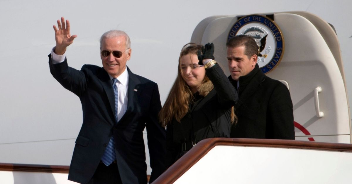 Then-Vice President Joe Biden, his son Hunter and Hunter's daughter Finnegan Biden begin a visit to Beijing on Dec. 4, 2013.