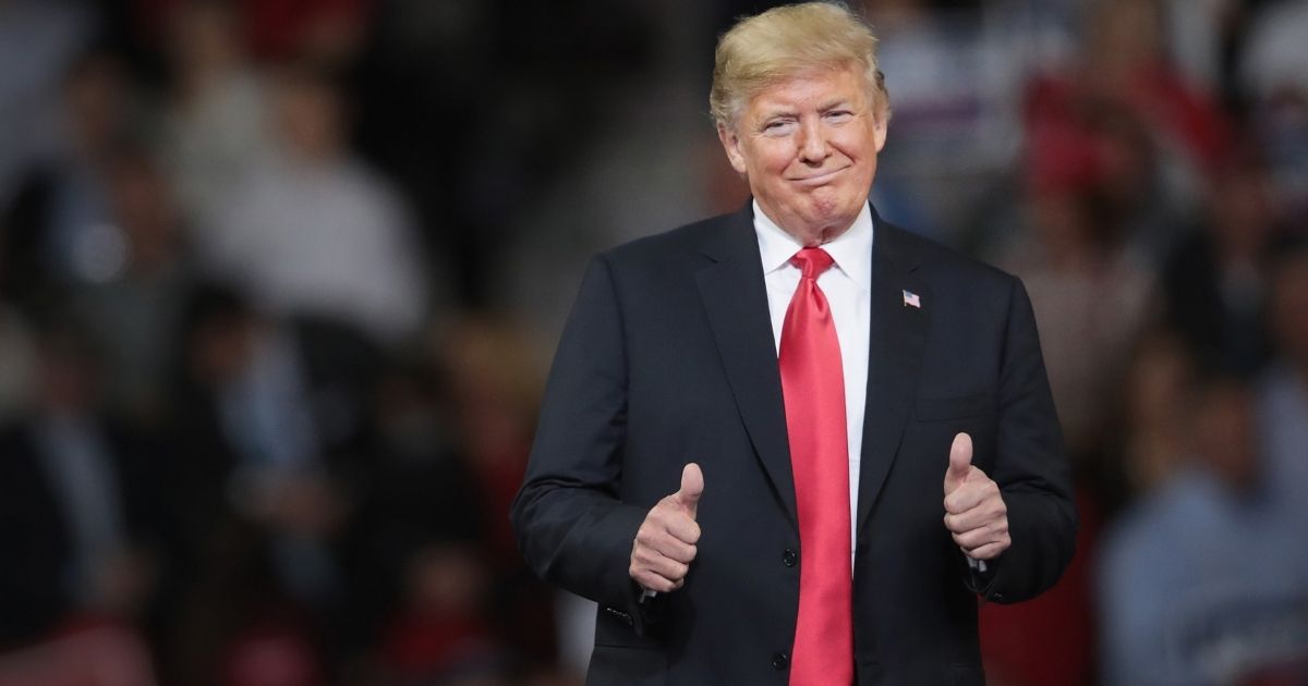 TOPEKA, KS - OCTOBER 06: U.S. President Donald Trump gestures while speaking to supporters during a rally at the Kansas Expocenter on October 6, 2018 in Topeka, Kansas. Trump scored a political victory today when Judge Brett Kavanaugh was confirmed by the Senate to become the next Supreme Court justice.