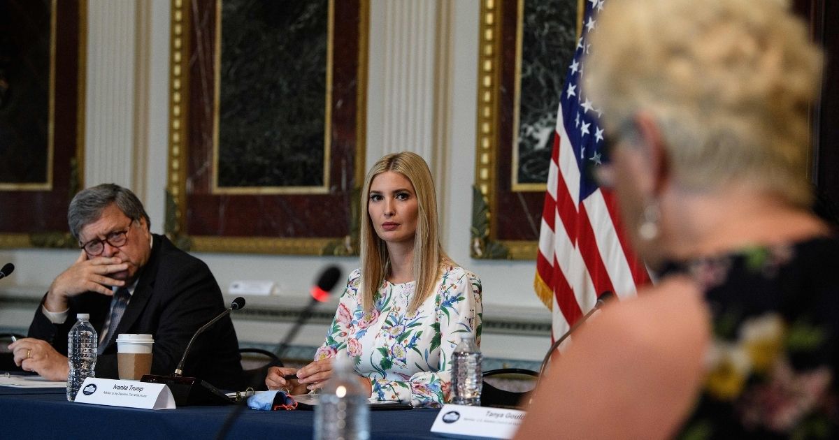 Ivanka Trump (C), daughter and adviser of US President Donald Trump, and US Attorney General Bill Barr attend a meeting on human trafficking at the Eisenhower Executive Office Building in Washington, DC, on August 4, 2020.